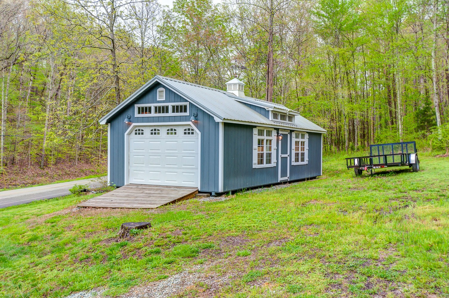 5934 Garrison Road Franklin, TN 37064 - Photo 9 of 39 a front view of a house with a yard and garage