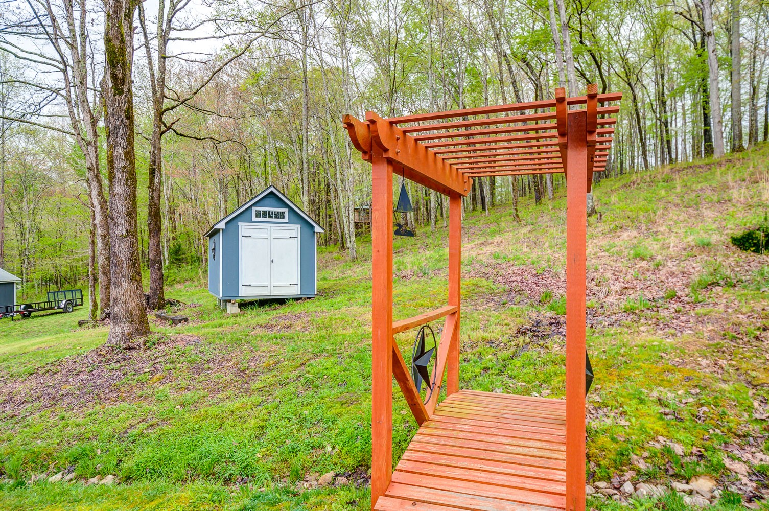 5934 Garrison Road Franklin, TN 37064 - Photo 10 of 39 a backyard of a house with wooden fence and large trees