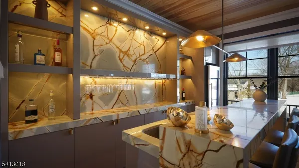 a kitchen with a sink a center island cabinets and a window