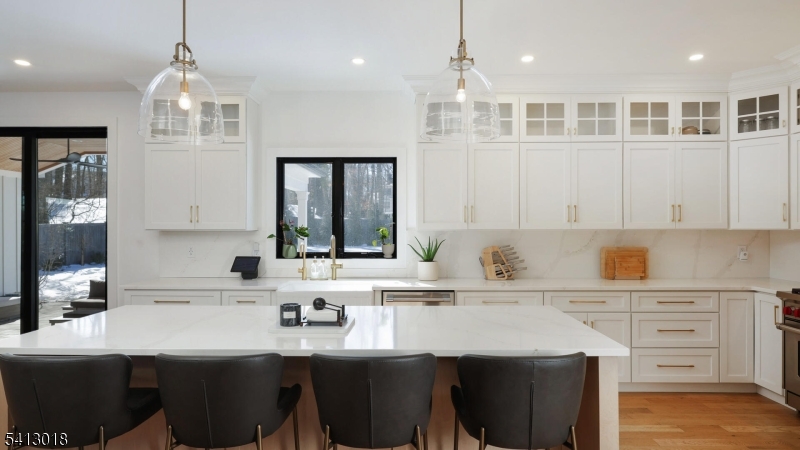 1613 Rising Way Westfield, NJ 07090 - Photo 16 of 50 a kitchen with a sink a center island cabinets and a window