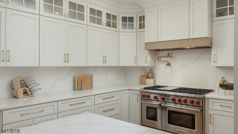 1613 Rising Way Westfield, NJ 07090 - Photo 21 of 50 a kitchen with granite countertop white cabinets and stainless steel appliances