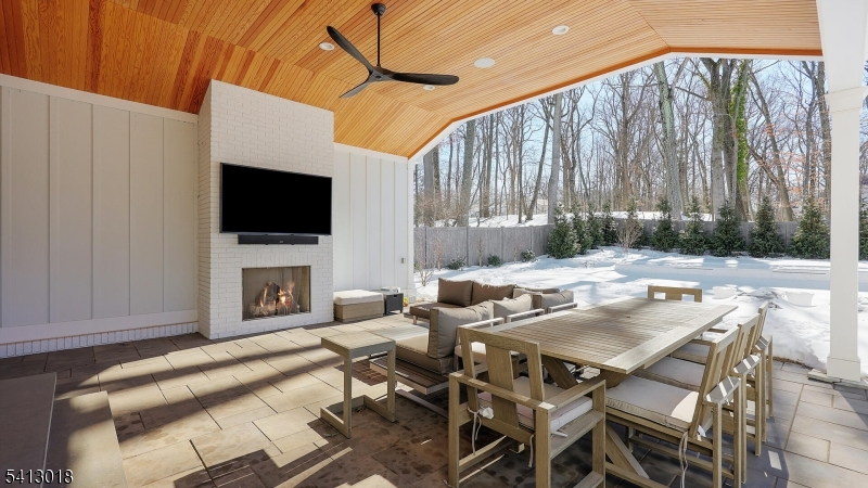 1613 Rising Way Westfield, NJ 07090 - Photo 28 of 50 a living room with furniture a flat screen tv and a fireplace