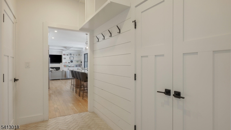 1613 Rising Way Westfield, NJ 07090 - Photo 29 of 50 a view of a hallway view with wooden floor and living room