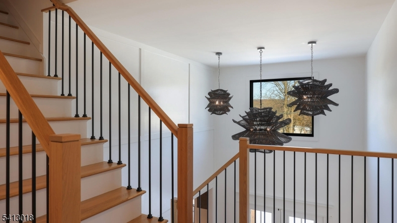 1613 Rising Way Westfield, NJ 07090 - Photo 33 of 50 a view of a hallway with wooden floor and staircase