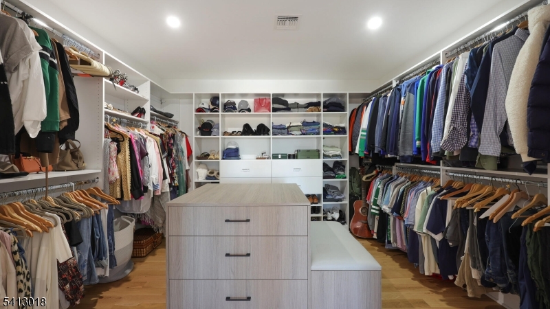1613 Rising Way Westfield, NJ 07090 - Photo 35 of 50 a view of walk in closet with clothes and shoes