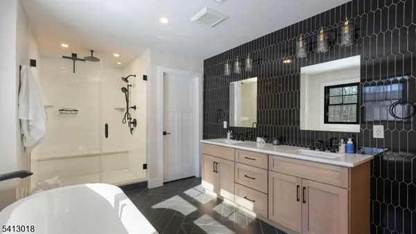 a spacious bedroom with a large bed and a window