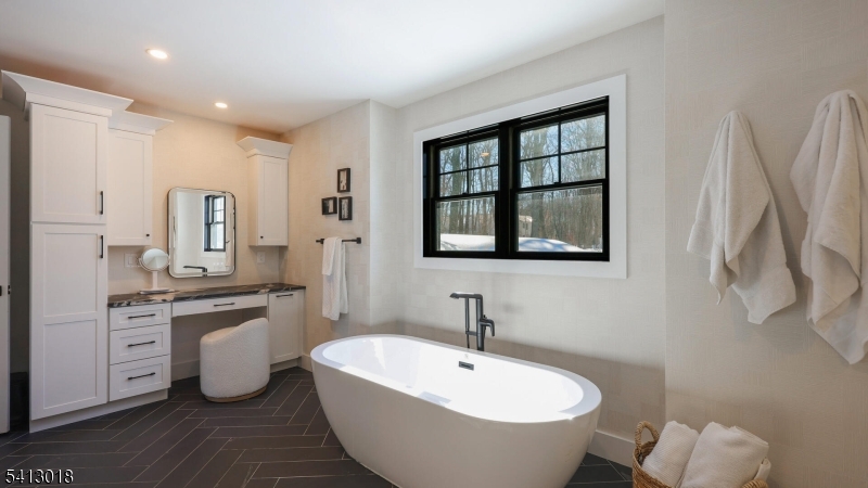 1613 Rising Way Westfield, NJ 07090 - Photo 37 of 50 a spacious bathroom with a granite countertop sink and a mirror