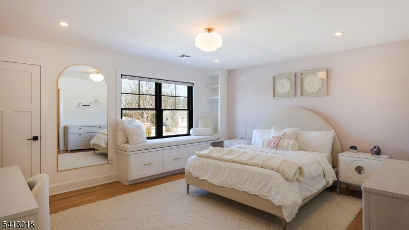 1613 Rising Way Westfield, NJ 07090 - Photo 38 of 50 a spacious bedroom with a large bed and a window