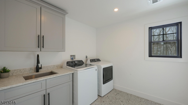 1613 Rising Way Westfield, NJ 07090 - Photo 44 of 50 a view of a storage and utility room with washer and dryer