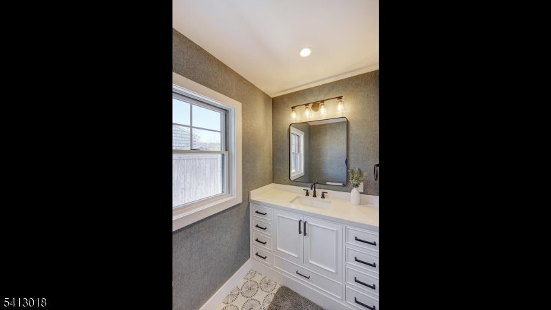 1613 Rising Way Westfield, NJ 07090 - Photo 45 of 50 a spacious bathroom with a double vanity sink toilet mirror and bathtub