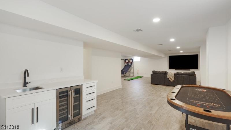 1613 Rising Way Westfield, NJ 07090 - Photo 47 of 50 a living room with furniture and a flat screen tv