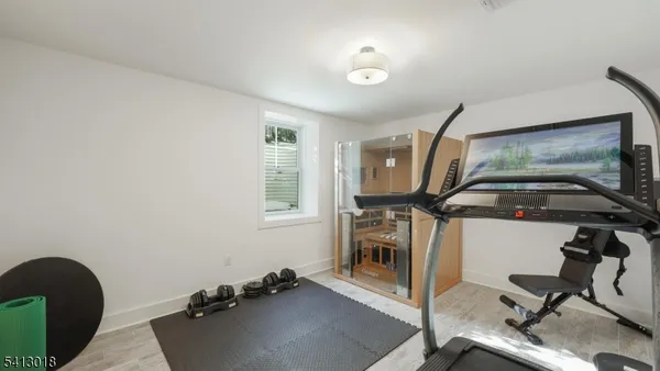 a living room with furniture and large windows