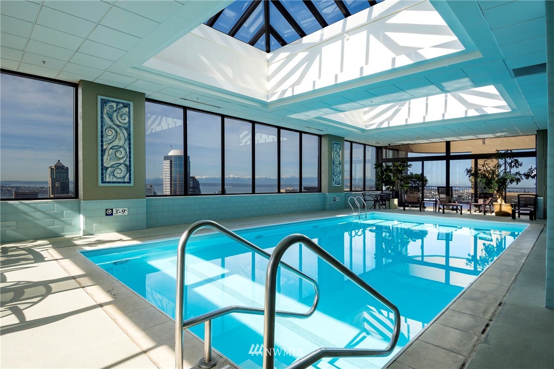1301 Spring Street, Unit 20G Seattle, WA 98104 - Photo 12 of 24 a view of swimming pool with outdoor seating