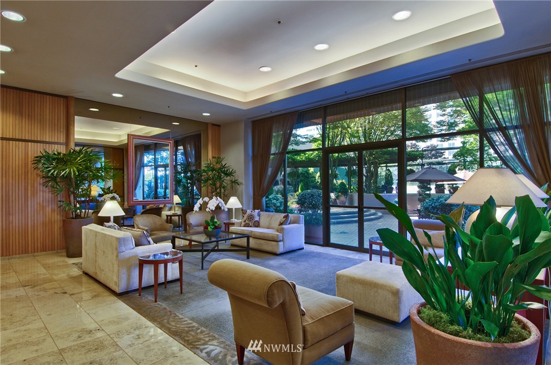1301 Spring Street, Unit 20G Seattle, WA 98104 - Photo 20 of 24 a living room with patio furniture and a potted plant