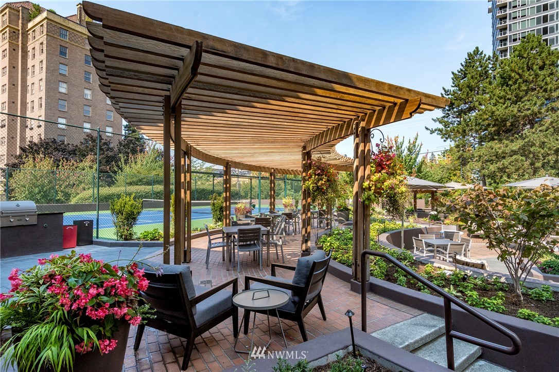 1301 Spring Street, Unit 20G Seattle, WA 98104 - Photo 23 of 24 a view of a chairs and table in the patio