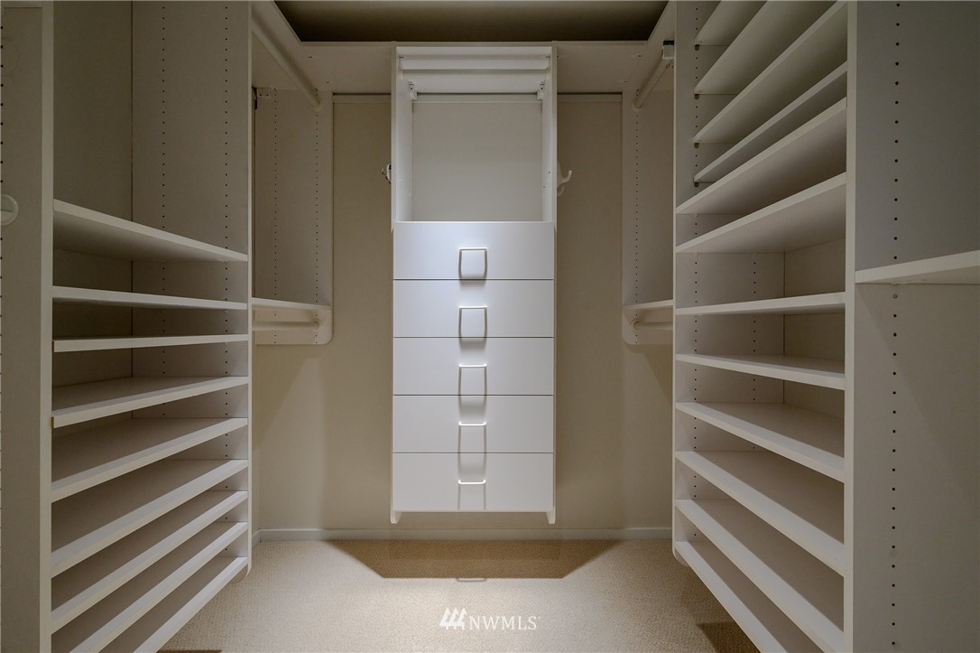 1301 Spring Street, Unit 20G Seattle, WA 98104 - Photo 9 of 24 a view of walk in closet with empty racks