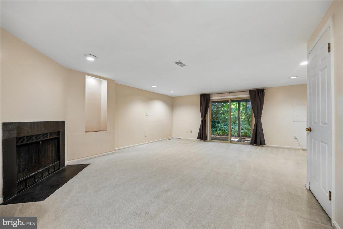 2459 McCormick Road Rockville, MD 20850 - Photo 40 of 74 Spacious Lower Level Rec Room with Fireplace