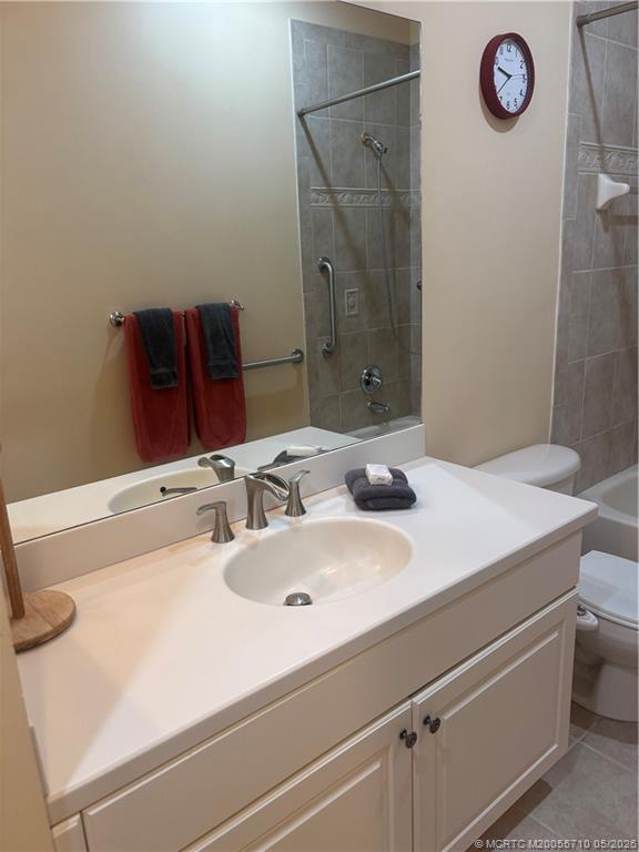 262 Southwest Walking Path, Unit 262 Stuart, FL 34997 - Photo 39 of 39 a bathroom with a sink and a mirror