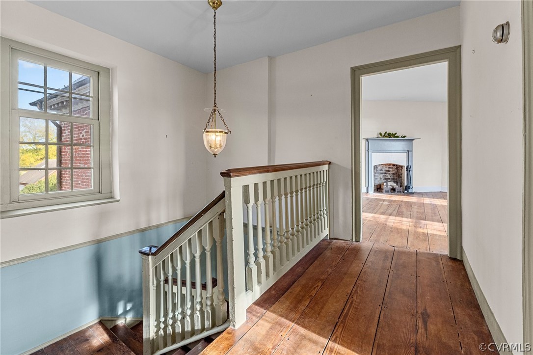 2494 Simonson Road Farnham, VA 22460 - Photo 29 of 50 a view of a hallway with wooden floor and staircase