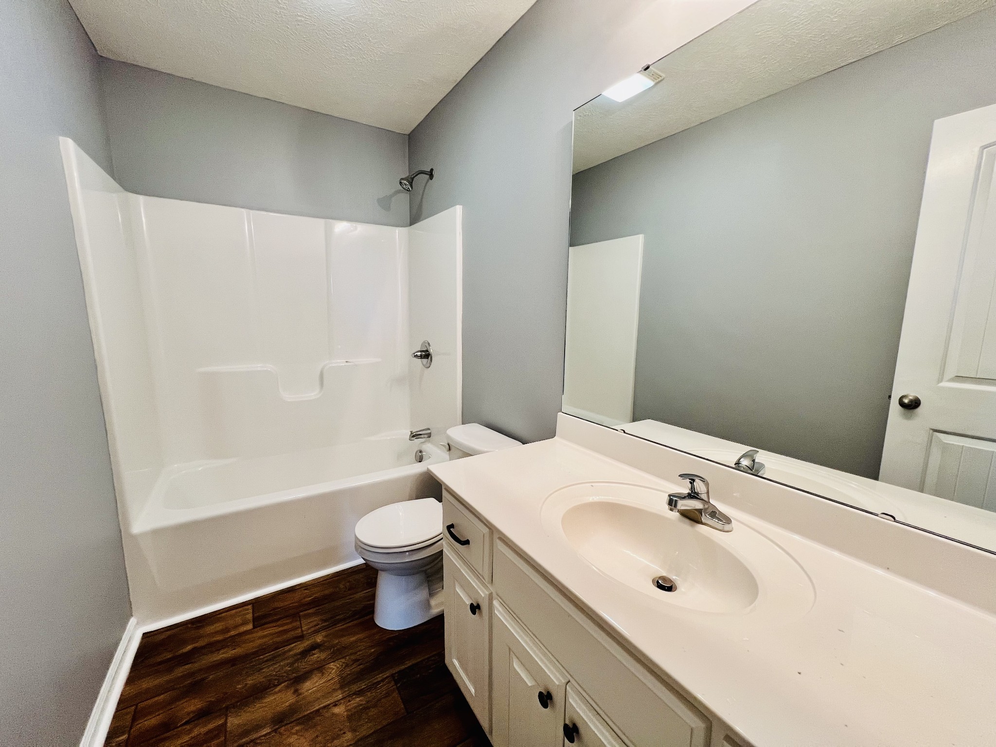 4560 Fall River Road Pulaski, TN 38478 - Photo 23 of 28 a bathroom with a sink a toilet and shower