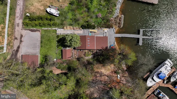 an aerial view of a houses with ocean view