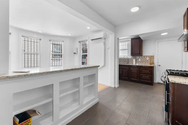 a kitchen with stainless steel appliances a sink and a stove