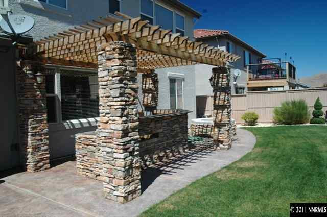 10760 Copper Lake Drive Reno, NV 89521 - Photo 8 of 8 a view of a house with sitting area and garden