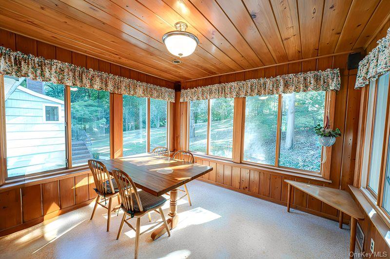562 Old Bridge Road Northport, NY 11768 - Photo 11 of 25 a dining room with furniture wooden floor and outer view