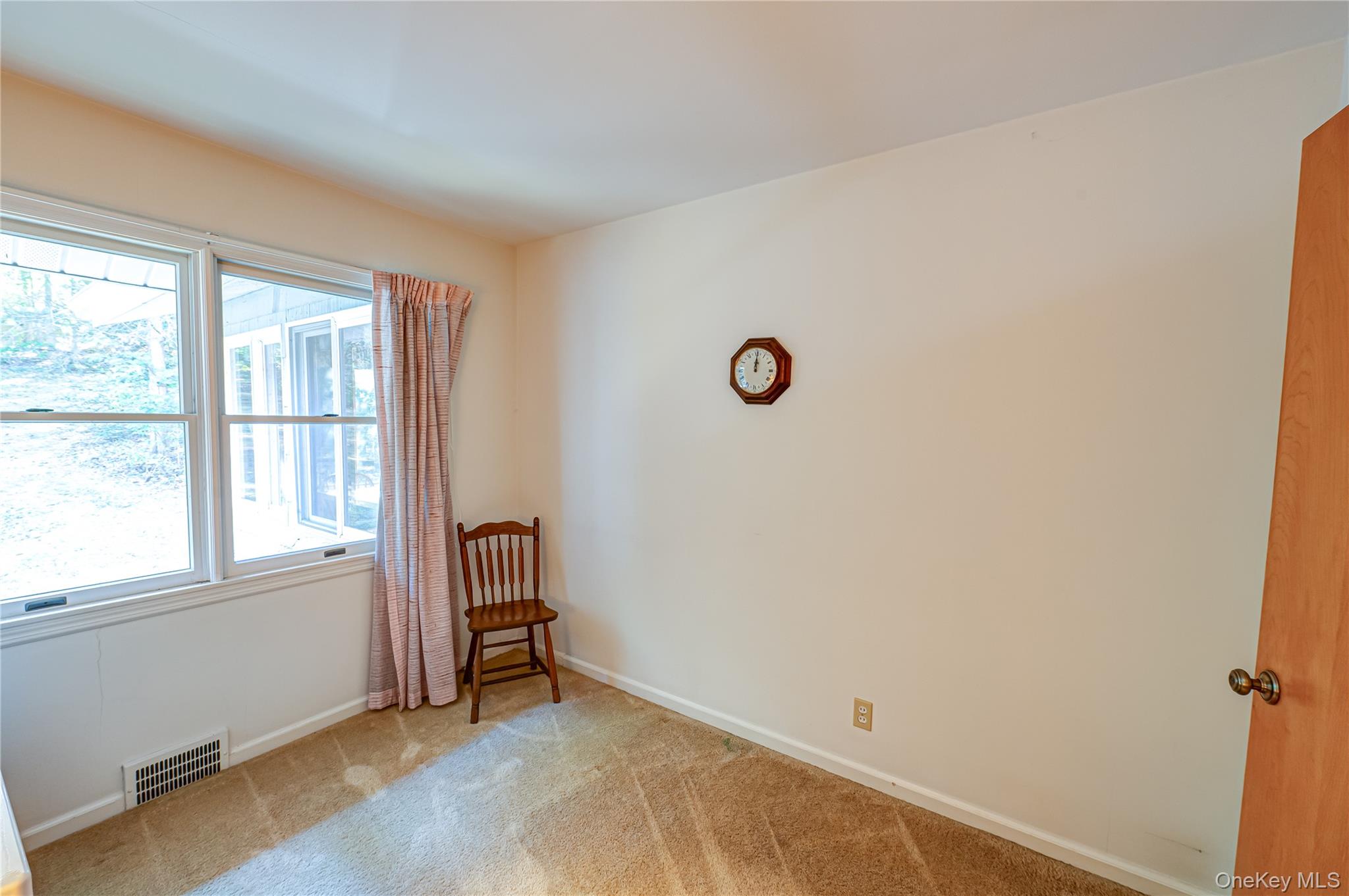 562 Old Bridge Road Northport, NY 11768 - Photo 17 of 25 a view of an empty room with a window