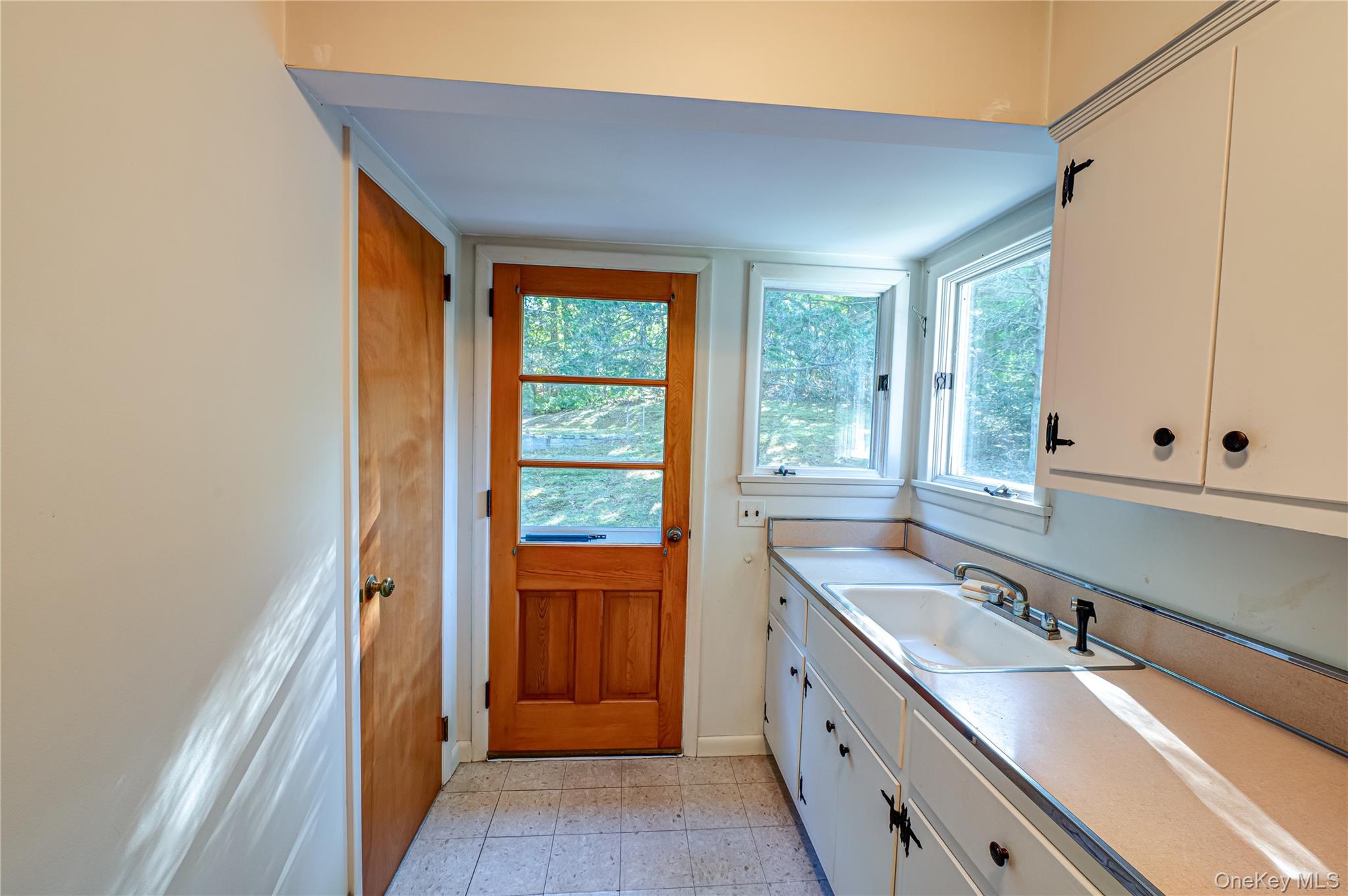 562 Old Bridge Road Northport, NY 11768 - Photo 22 of 25 a bathroom with a granite countertop sink and a large mirror