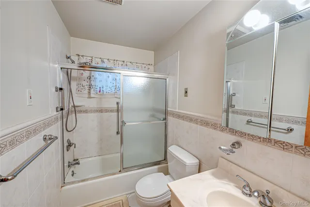 a bedroom with furniture and window