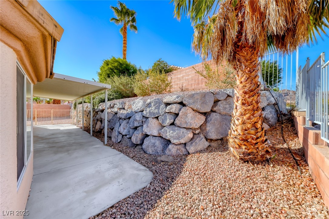 698 Magic Cove Court Boulder City, NV 89005 - Photo 12 of 41 Fenced backyard with a patio