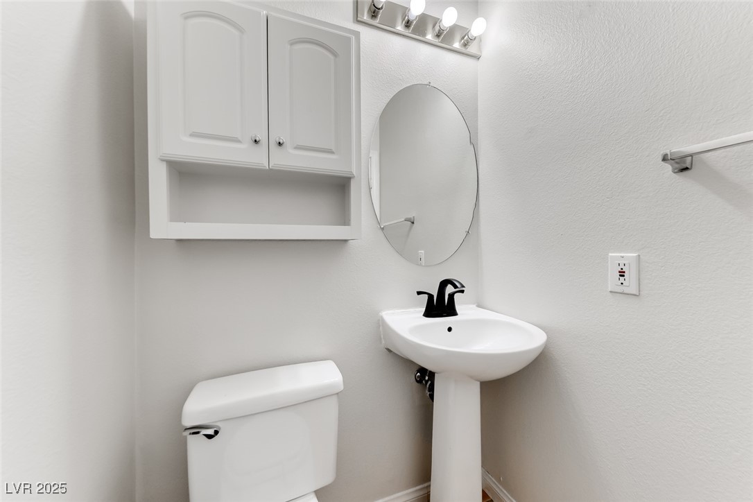 698 Magic Cove Court Boulder City, NV 89005 - Photo 18 of 41 Bathroom featuring a textured wall and toilet