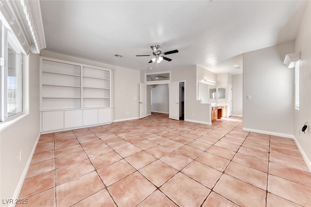 698 Magic Cove Court Boulder City, NV 89005 - Photo 22 of 41 Unfurnished living room with light tile patterned floors and a ceiling fan