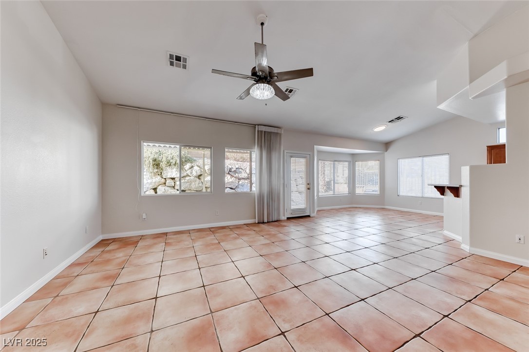 698 Magic Cove Court Boulder City, NV 89005 - Photo 28 of 41 Spare room featuring light tile patterned floors and a ceiling fan