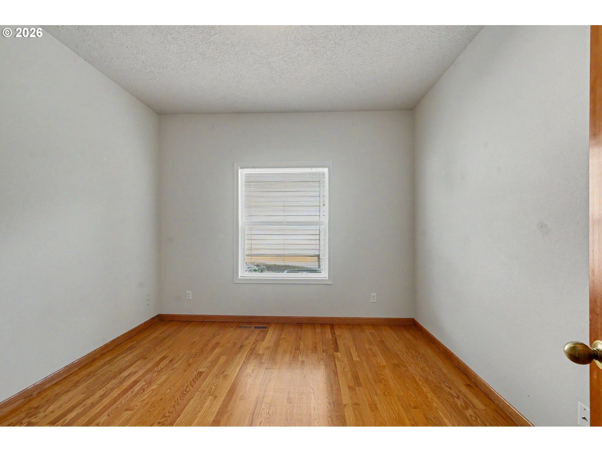 1470 Ranier Loop Northwest Salem, OR 97304 - Photo 39 of 48 a view of an empty room and wooden floor