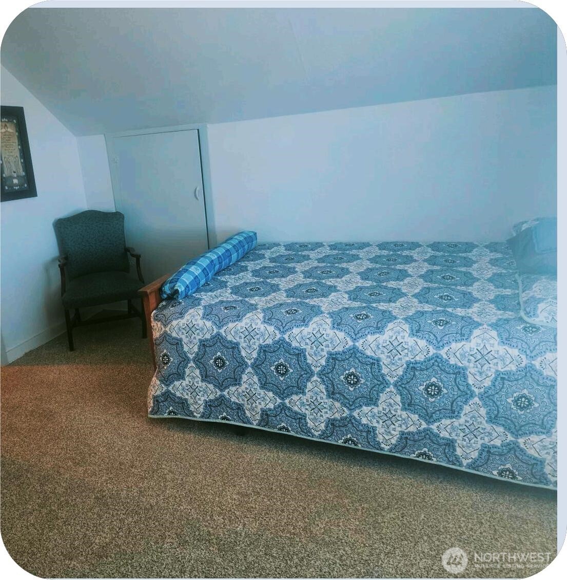 15650 Huddle Corner Road Harrington, WA 99134 - Photo 15 of 20 a bedroom with a bed and a chair