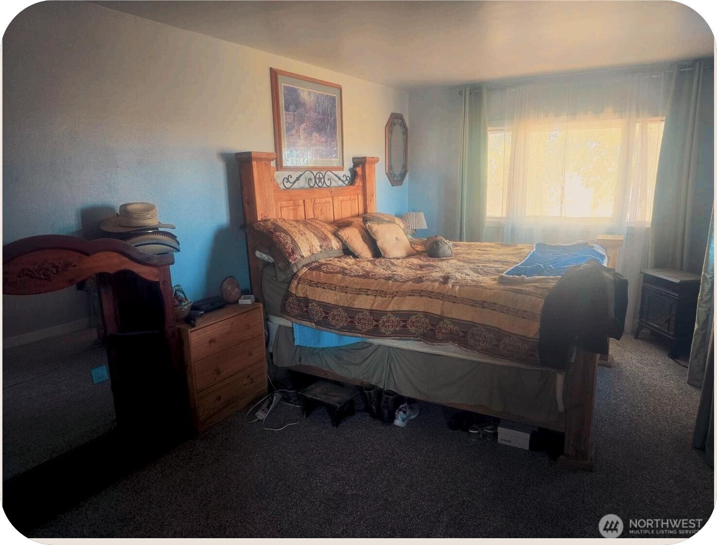 15650 Huddle Corner Road Harrington, WA 99134 - Photo 9 of 20 a bed sitting in a bedroom next to a window