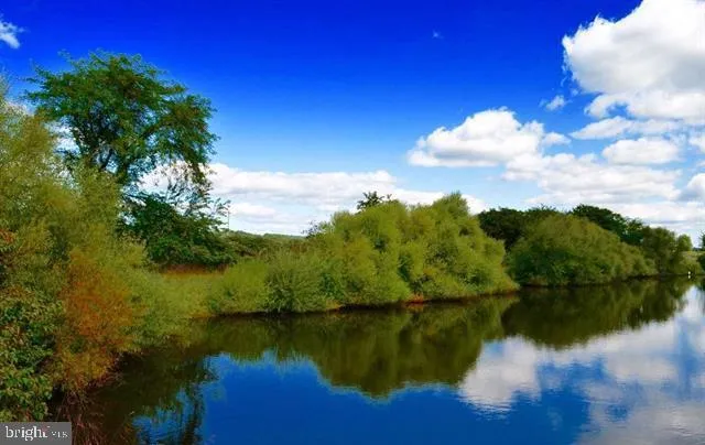 a bed sitting in a bedroom next to a wall