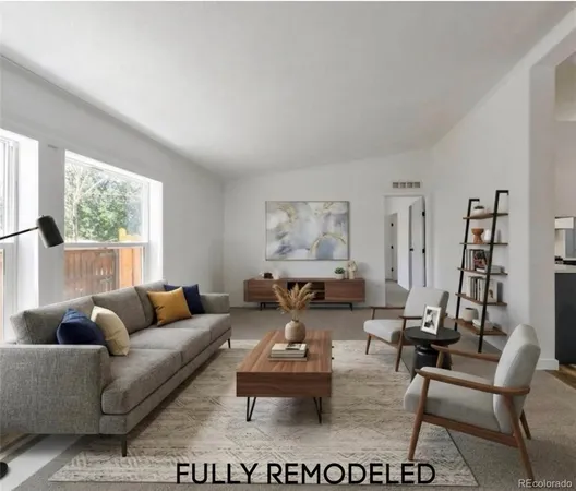 a living room with furniture a large window and a flat screen tv