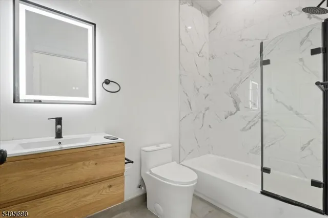 a bathroom with a sink a toilet and a bathtub