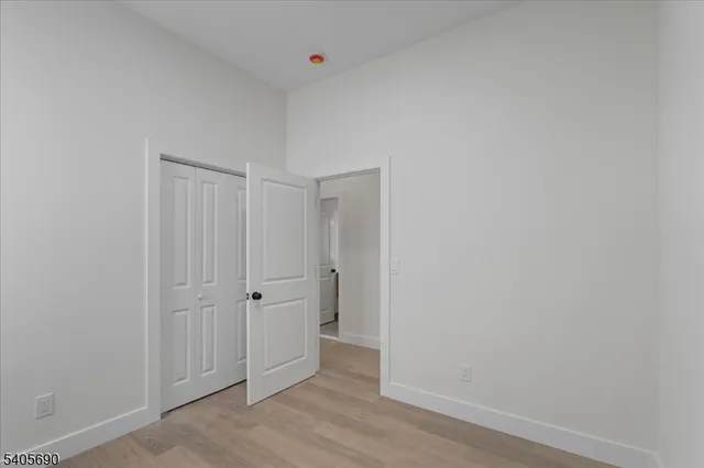 an empty room with wooden floor