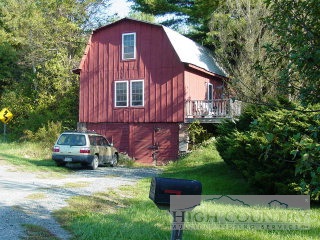 122 Brown's Chapel Road Boone, NC 28607 - Photo 1 of 1 a view of a car in front of a house with a small yard