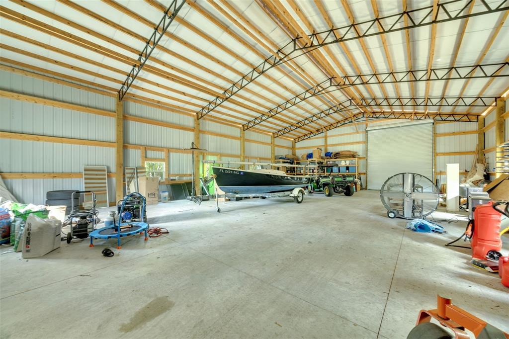 3535 Moores Lake Road Dover, FL 33527 - Photo 66 of 85 40x60 Garage Workshop - The two 14' tall roll-up doors create a DRIVE-THROUGH!