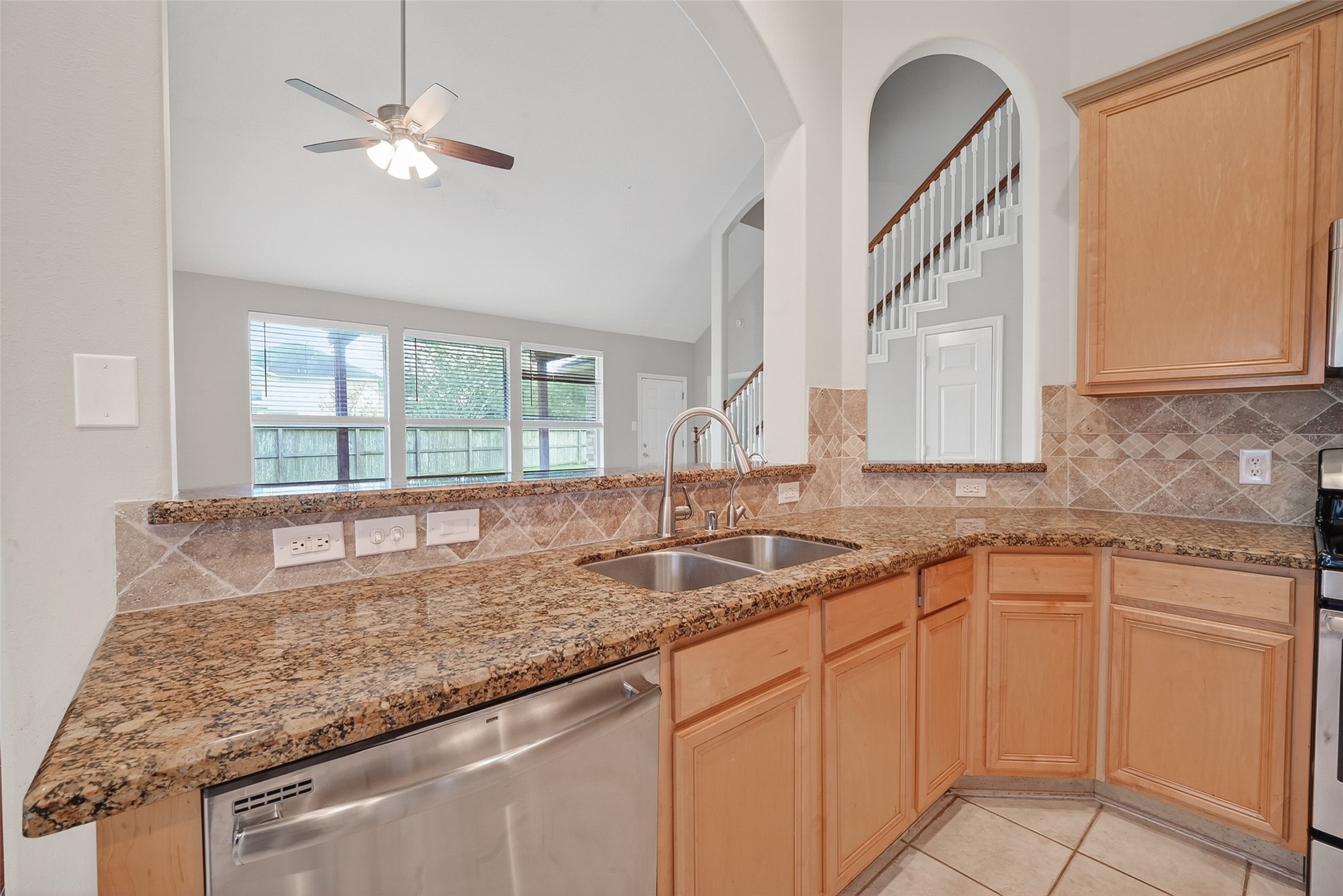 14308 Rocky Briar Lane Rosharon, TX 77583 - Photo 14 of 46 a kitchen with granite countertop cabinets sink and window