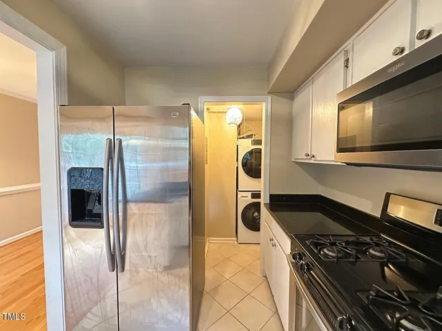 a kitchen with a stove and a refrigerator