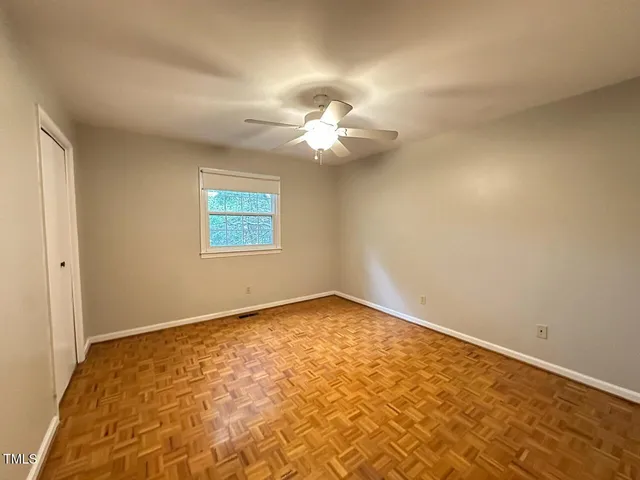 a view of a big room with carpet