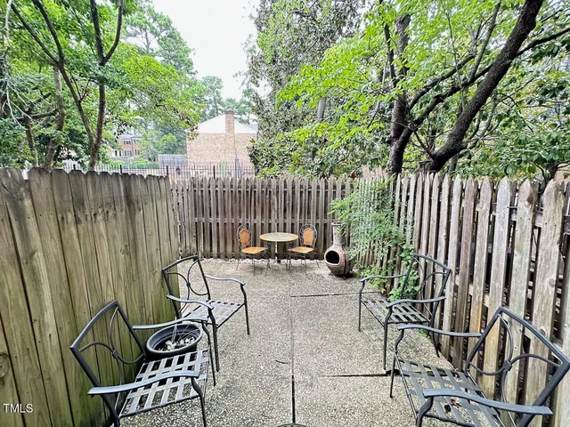 a view of outdoor dining space with chairs and tables