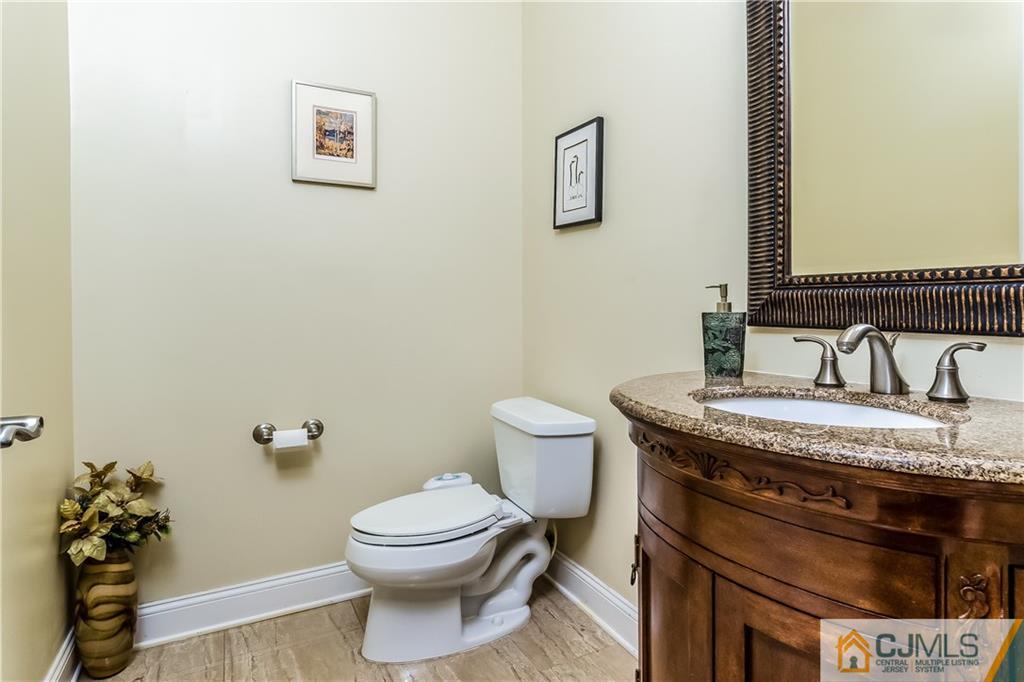 437 Vanderveer Road Raritan, NJ 08869 - Photo 11 of 25 a bathroom with a granite countertop toilet and a sink