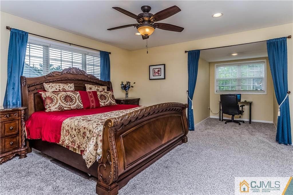 437 Vanderveer Road Raritan, NJ 08869 - Photo 13 of 25 a bedroom with a bed and a chandelier